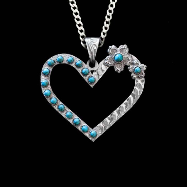 This heart shaped pendant is the picture of Southern Charm. The Turquoise Heart Custom Pendant features a hand engraved german silver base with two gorgeous flowers. Order it now! 